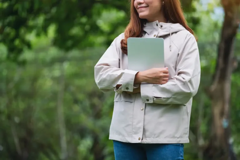 An ecologist recording survey data on a tablet